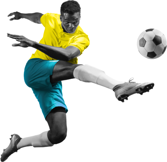 Spieler in gelbem Trikot und blauen Shorts in einer spannenden Fußballaktion mit Ball.